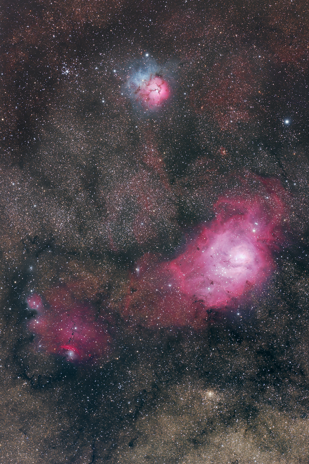 M8 (Lagoon Nebula) and M20 (Trifid Nebula) taken with a Takahashi FSQ-106EDX-III Telescope. Click for a larger version.